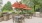 Grilling area with grills and tables with red umbrellas