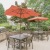 Grilling area with grills and tables with red umbrellas